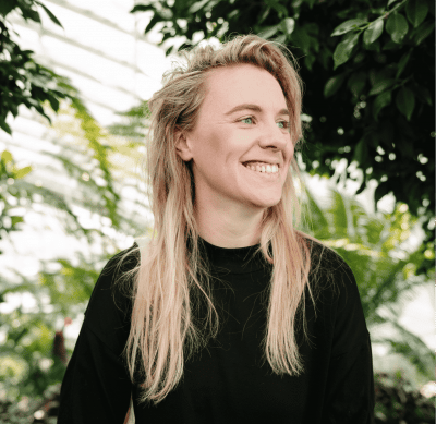 A woman smiling to the side