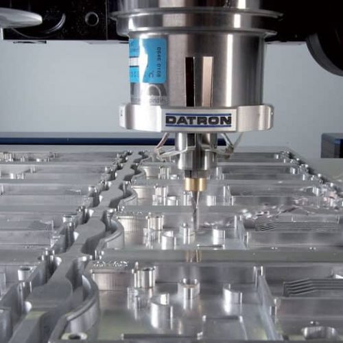 CNC machining working on a metal plate