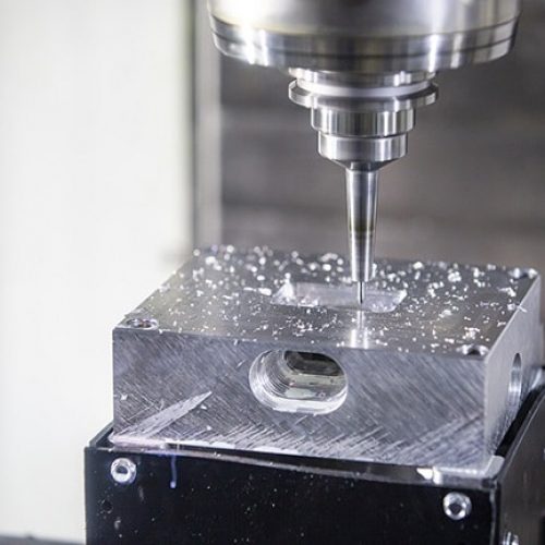 A CNC milling machine working on metal