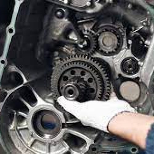 A robot repairing a large gear