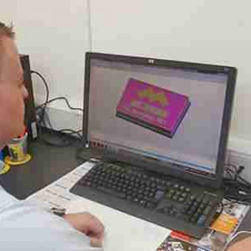 A man working on a CNC program