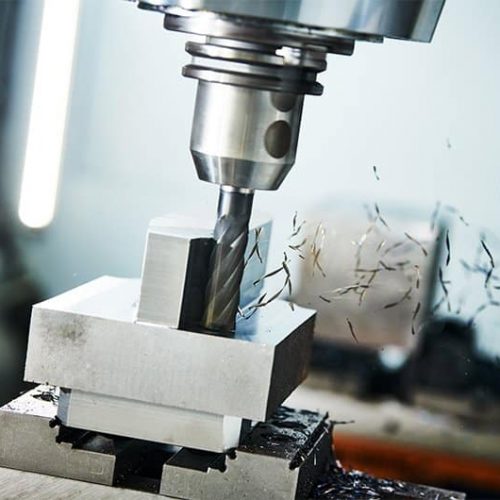 A CNC milling machine with fragments falling away, alternative